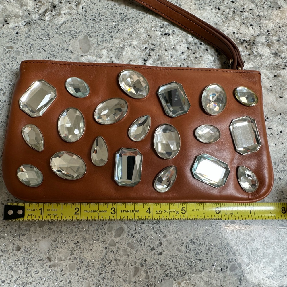 DKNY saddle color wristlet with rhinestones